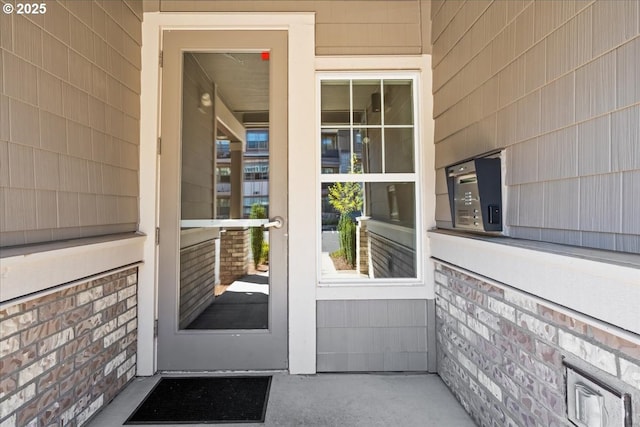 view of exterior entry featuring a porch