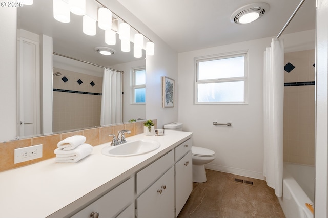 full bathroom with toilet, vanity, and shower / tub combo