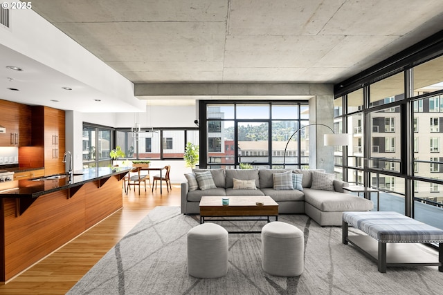 1830 NW Riverscape St Unit 406, Portland, OR 97209 - living area featuring a wealth of natural light and light wood-type flooring