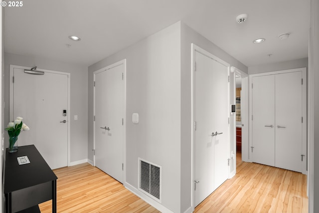 1830 NW Riverscape St Unit 406, Portland, OR 97209 - corridor featuring visible vents, recessed lighting, baseboards, and wood finished floors