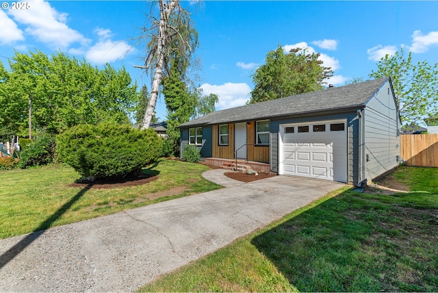 single story home featuring a front lawn, a garage, fence, and concrete driveway