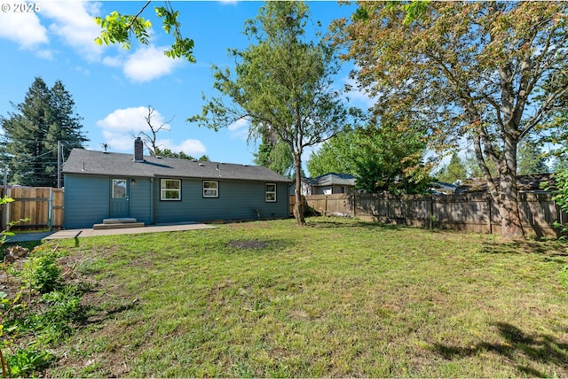 view of yard featuring a fenced backyard and a patio
