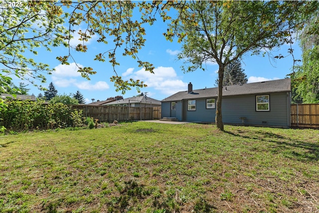 view of yard with a fenced backyard and a patio area