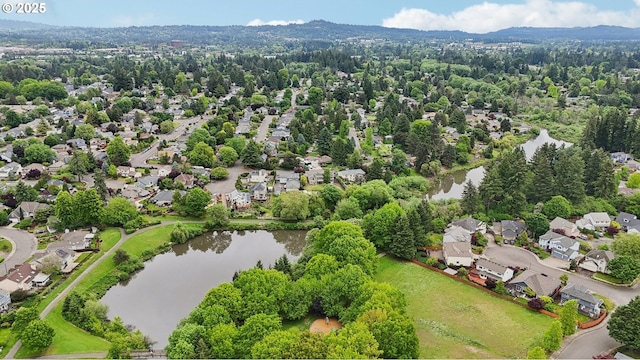 aerial view of residential area with a nearby body of water