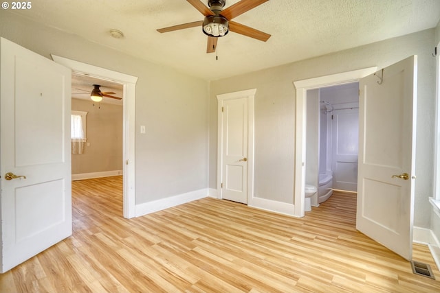 1206 E 9th St, The Dalles, OR 97058 - unfurnished bedroom with ceiling fan, a textured ceiling, visible vents, baseboards, and light wood finished floors