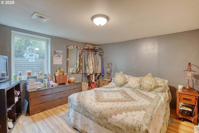 bedroom featuring light hardwood / wood-style flooring