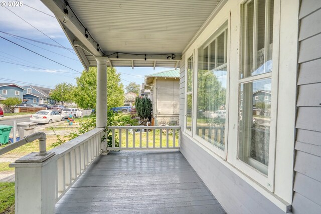 1206 E 9th St, The Dalles, OR 97058 - wooden deck with covered porch