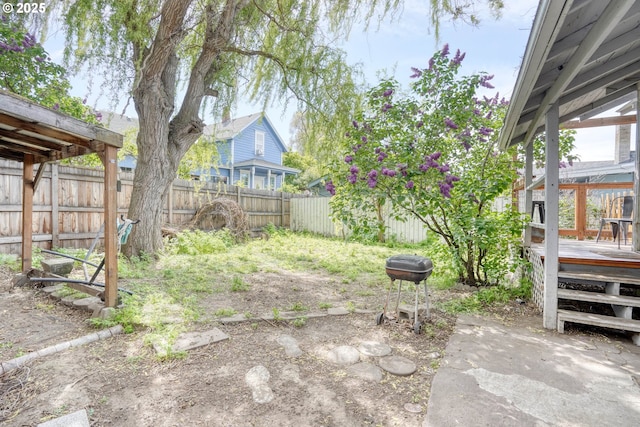 1206 E 9th St, The Dalles, OR 97058 - view of yard featuring a fenced backyard and a wooden deck