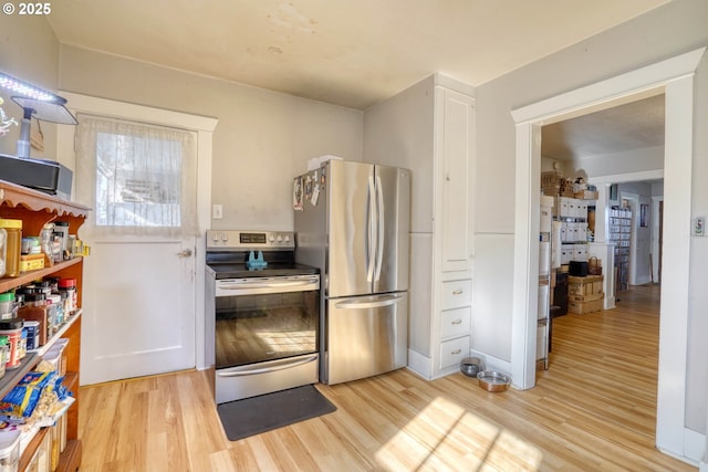 kitchen featuring appliances with stainless steel finishes and light wood-type flooring