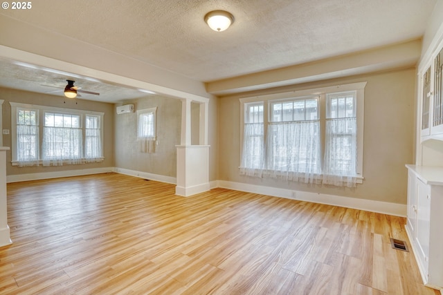1206 E 9th St, The Dalles, OR 97058 - interior space with visible vents, baseboards, light wood-type flooring, a textured ceiling, and a ceiling fan