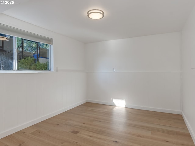 unfurnished room with light hardwood / wood-style flooring