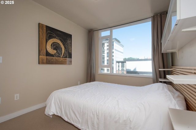 carpeted bedroom with baseboards