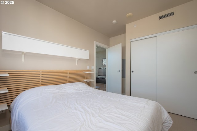 bedroom with visible vents and a closet