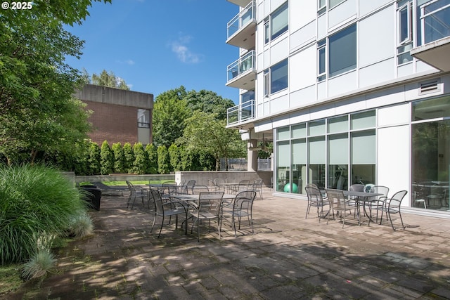 deck featuring outdoor dining area and a patio