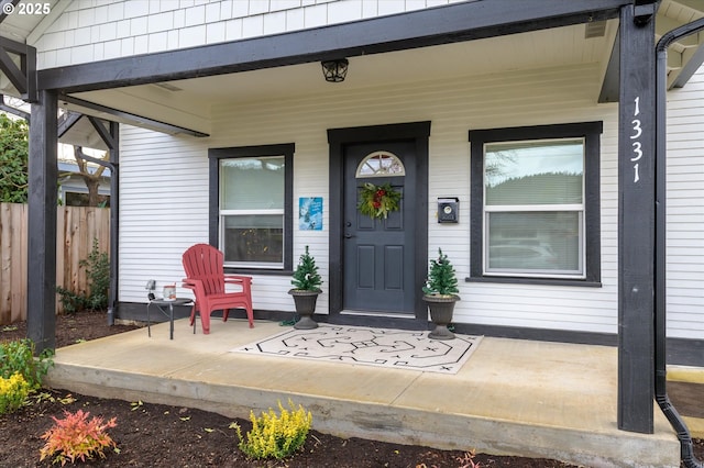 doorway to property with a porch