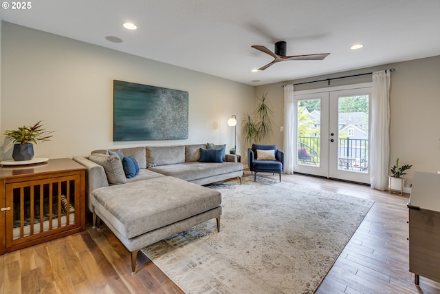 living area with a ceiling fan, wood finished floors, french doors, and recessed lighting