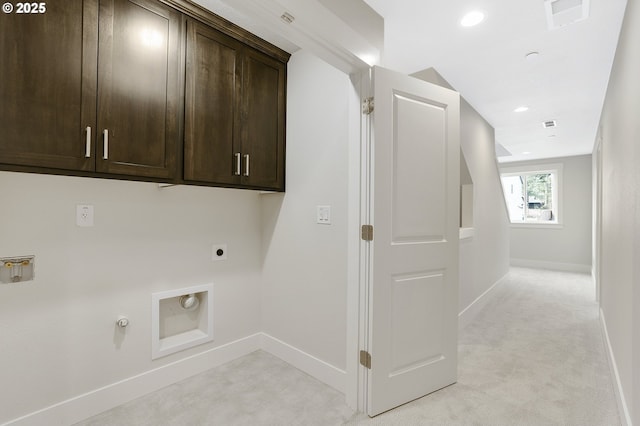 washroom with gas dryer hookup, cabinets, light carpet, washer hookup, and hookup for an electric dryer