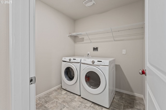9465 N Alder St, Camas, WA 98607 - laundry room with washing machine and dryer and stone finish floors