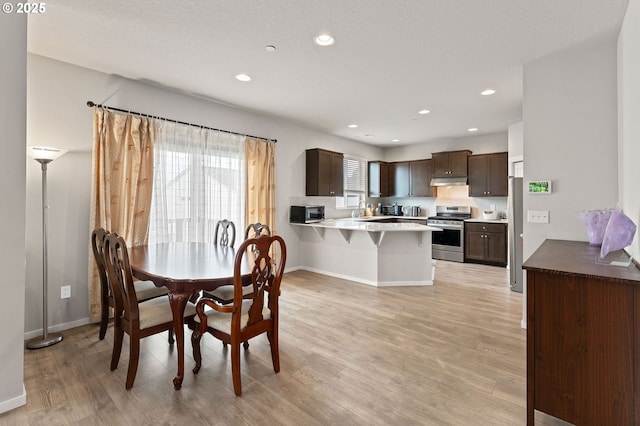 9465 N Alder St, Camas, WA 98607 - dining area featuring light wood-type flooring and recessed lighting