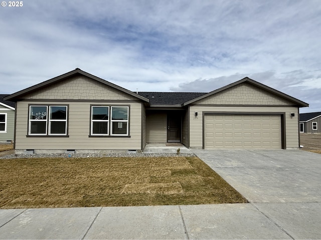 single story home featuring a garage, a front yard, and concrete driveway