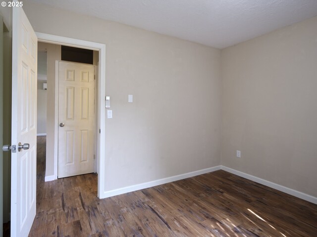1818 E 32nd St, Vancouver, WA 98663 - empty room with baseboards and dark wood-style floors