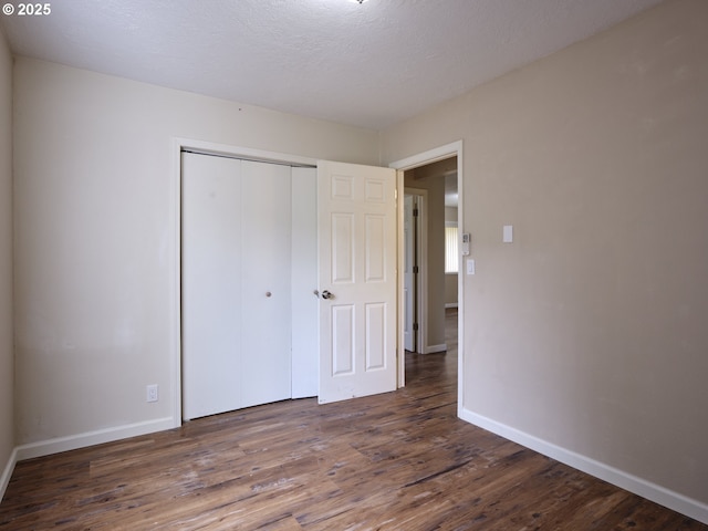 1818 E 32nd St, Vancouver, WA 98663 - unfurnished bedroom with wood finished floors and a closet