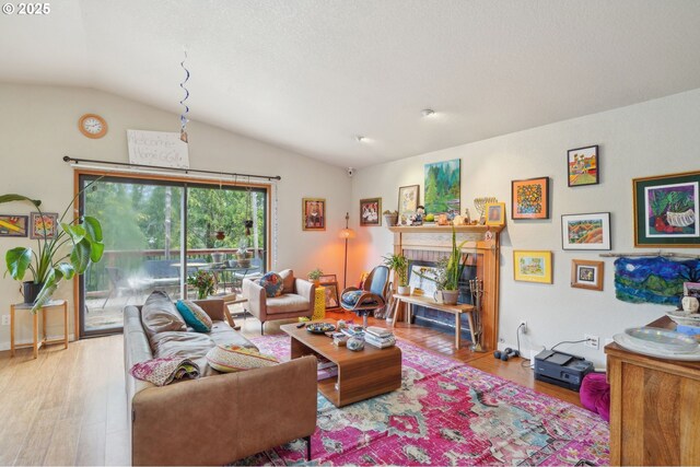 living room featuring an AC wall unit, wood finished floors, and recessed lighting