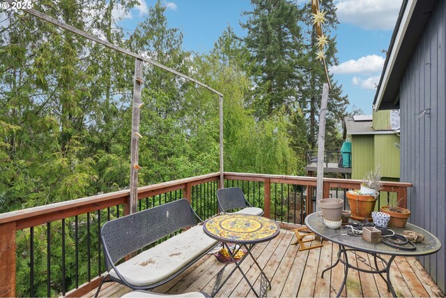 fenced backyard with a garden, stairway, and a deck