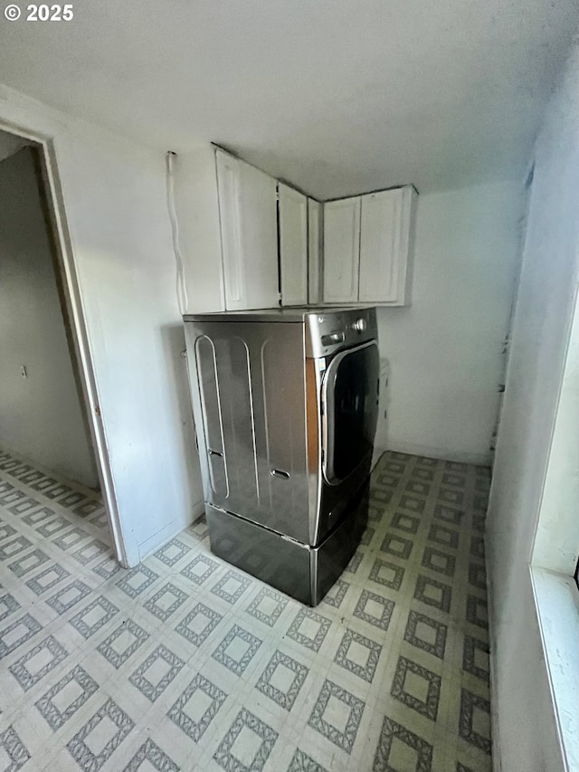 855 Myrtle Ave, Reedsport, OR 97467 - laundry room featuring washer / clothes dryer, cabinet space, and light floors