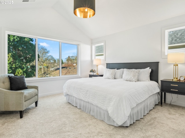 carpeted bedroom featuring lofted ceiling