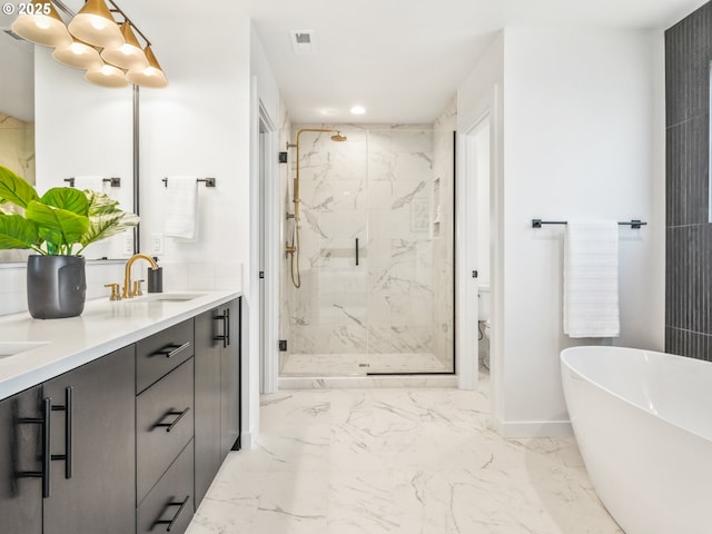 bathroom with independent shower and bath and vanity