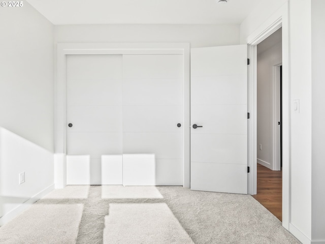 carpeted bedroom with a closet