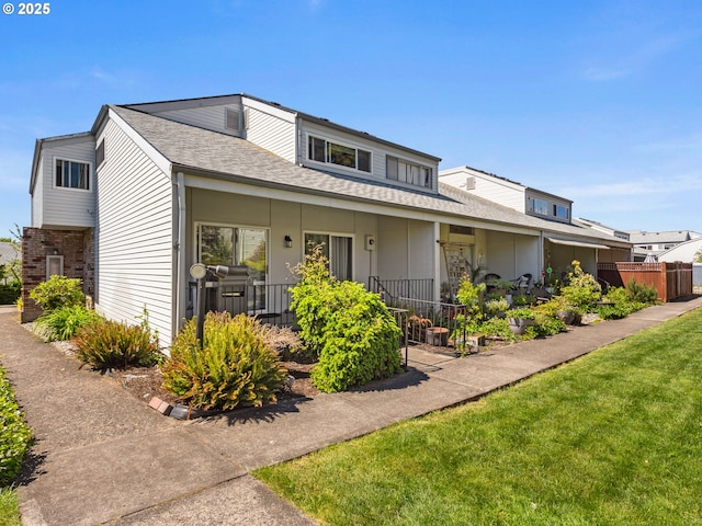 view of front of house featuring a shingled roof, a porch, and board and batten siding
