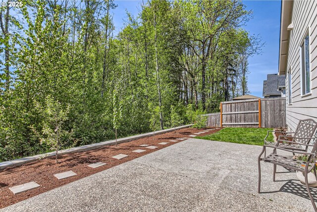 view of patio / terrace featuring fence