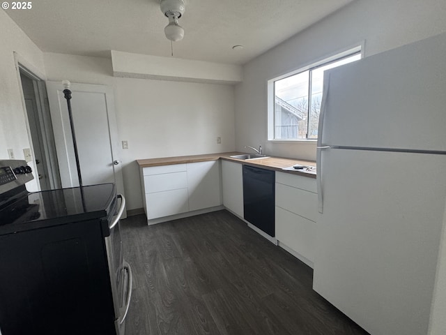 kitchen with stainless steel range with electric stovetop, dark wood-style floors, freestanding refrigerator, white cabinets, and dishwasher