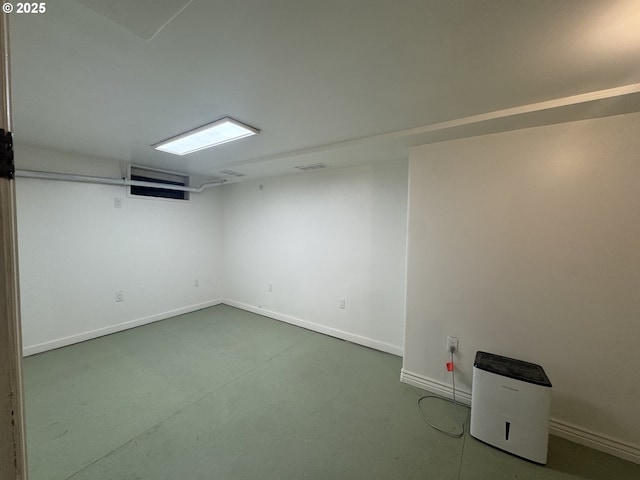 finished basement featuring visible vents and baseboards