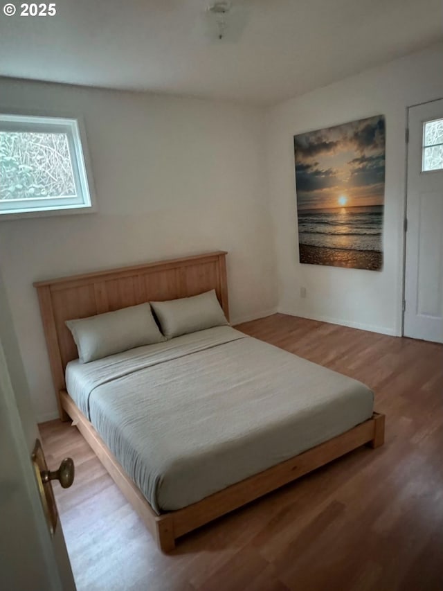 bedroom with light wood finished floors