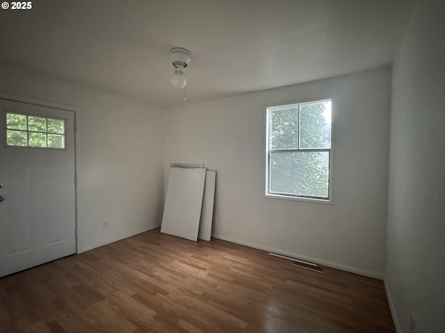 unfurnished room featuring wood finished floors