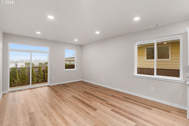 spare room with light wood-type flooring