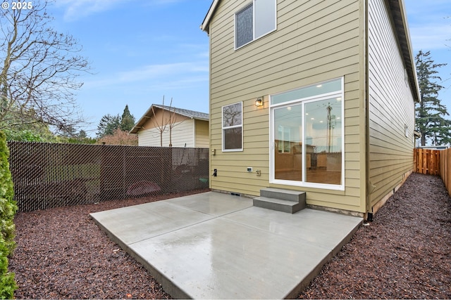 back of property featuring a patio