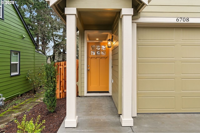 doorway to property with a garage