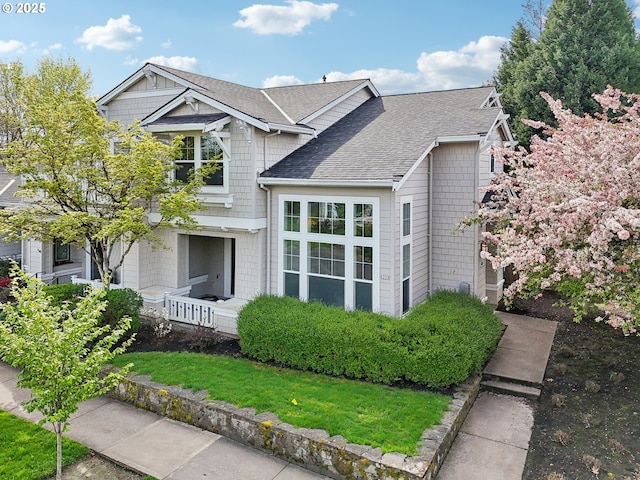 view of front of home featuring a shingled roof