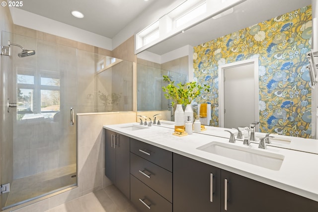 bathroom with vanity, tile patterned floors, and a shower with door