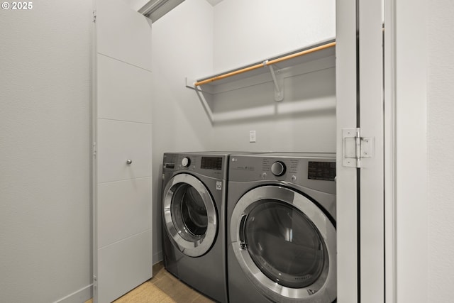 laundry room featuring separate washer and dryer