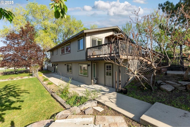 301 S 18th St, La Grande, OR 97850 - view of front of house featuring a front yard, a wooden deck, and a patio