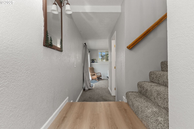 301 S 18th St, La Grande, OR 97850 - hallway with a textured wall, stairway, and carpet floors