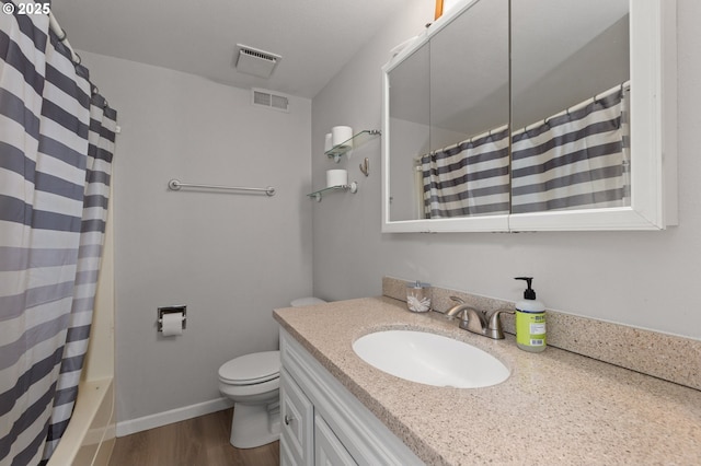 301 S 18th St, La Grande, OR 97850 - bathroom with vanity, wood finished floors, and toilet