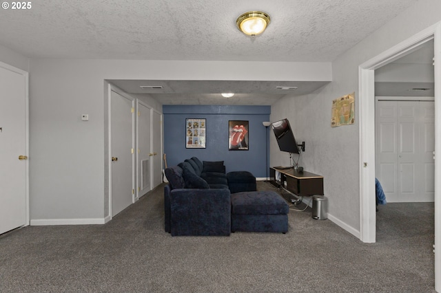 301 S 18th St, La Grande, OR 97850 - carpeted living room with a textured ceiling and baseboards