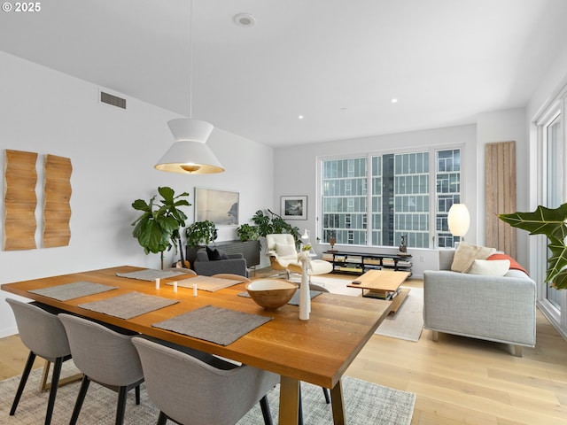 dining space with light wood-type flooring