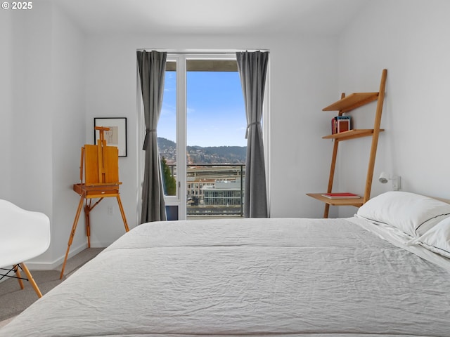 carpeted bedroom with a mountain view